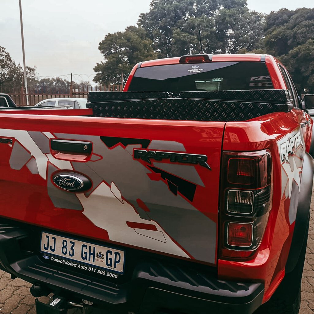 Red Ford Raptor with Black Range Taurus Toolbox